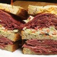 Dagwood Sandwich · Two of our bestselling meats, Pastrami and Corned Beef piled high between three layers of ou...