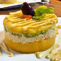 Peruvian Causas · Smooth Peruvian potato cake seasoned with lime juice, yellow pepper and layered with
your ch...