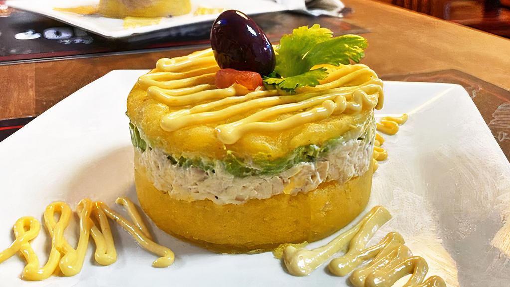 Peruvian Causas · Smooth Peruvian potato cake seasoned with lime juice, yellow pepper and layered with
your choice of::
Tuna: 8.99
Chicken: 8.99
Shrimp: 11.99