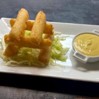 Yuquitas Fritas Con Huancaina · Fried Yuca with side of Huancaina sauce (Peruvian Yellow pepper cheese sauce)