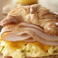 The Turkey Day Sandwich · A buttery croissant with sliced turkey, fried egg and cheese.