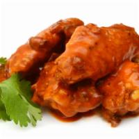 Chicken Wings · Oven baked warm and crispy chicken wings served with either buffalo or blue cheese sauce.