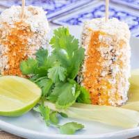 Elotes · Fire-roasted sweet corn, chipotle mayo, cotija cheese, piquin pepper seasoning, cilantro