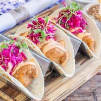Baja Fish Tacos · Tempura Corvina, pickled red cabbage slaw, chipotle mayo, flour tortilla.