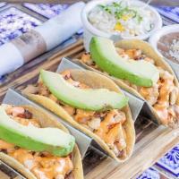 Baja Chicken Tacos · Grilled chicken breast, melted Chihuahua cheese, refried beans, crispy smoked bacon, avocado...