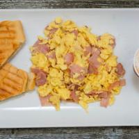 Cuban Breakfast · Scrambled eggs with ham and tostada.