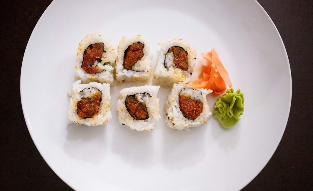 Spicy Tuna Roll · Seasoned tuna. Fresh seafood rolled in sushi rice and seaweed topped with sesame seeds.
