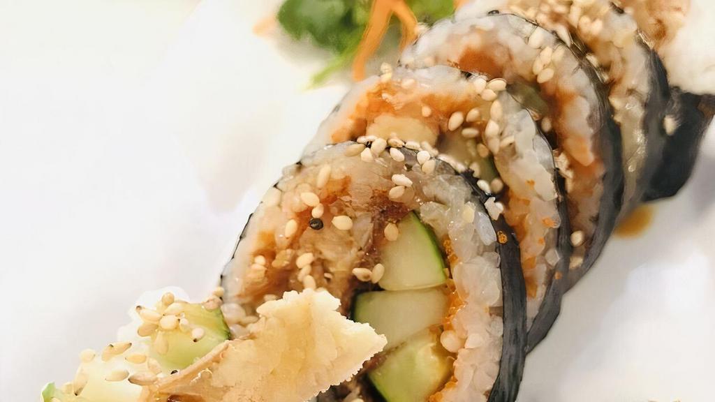 Spider Roll · Crispy soft shell crab, cucumber, and masago. Fresh seafood rolled in sushi rice and seaweed topped with sesame seeds.