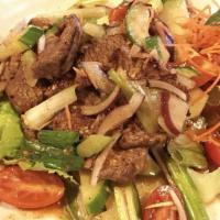 Beef Salad · Spicy. A combination of sliced steak, tomatoes, cucumbers, onions, celery, and scallions mix...