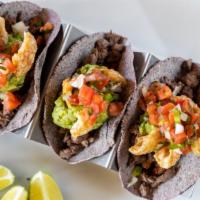 Ahtziri · Pork and steak combo, guacamole and chicharon with blue tortilla.