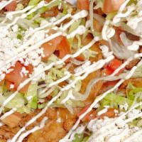 Tostadas · Three per order. Crispy com tortilla, beans, lettuce, cheese and tomato.