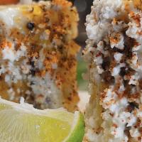 Elotes · Four per order. Corn, mayo, fresh cheese and chile power.