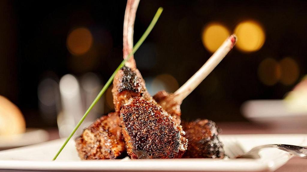 Double-Cut Lamb Chops* | Gf · Three lamb lollipops char-broiled and served with a Truffle Merlot Demiglace