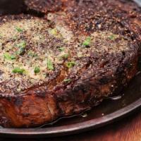 Pecan-Smoked Caramelized Prime Rib, 16 Oz* | Gf · Choice Ribeye seasoned and slow smoked in pecan wood, crusted and seared, topped with steak ...