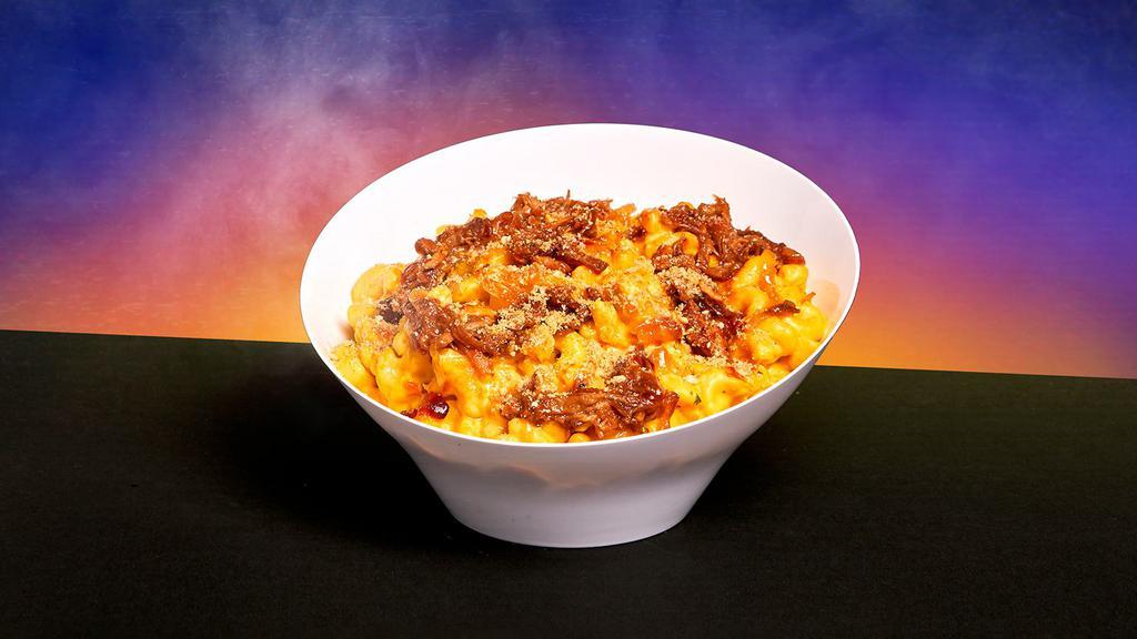 Pulled Pork Mac And Cheese · Classic mac and cheese with pulled pork, BBQ sauce, and sliced scallions.