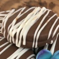 Chocolate Dipped Oreos (4) · Chocolate Oreo dipped in milk chocolate, drizzled with white chocolate and brushed with gold...