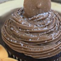 Sea Salt Caramel Cupcake · A decadent chocolate cupcake, paired with rich caramel buttercream and garnished with a bite...