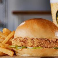 Hand Breaded Big & Golden Chicken Sandwich · A Big Crispy Marinated Breast Filet, Topped With Our Spicy Lotta Zing® Sauce • 5 Dill Pickle...