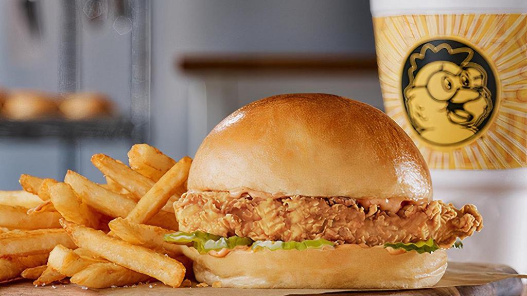 Big & Golden Chicken Sandwich · A Big Crispy Marinated Breast Filet, Topped With Our Spicy Lotta Zing® Sauce • 5 Dill Pickles Slices All On An Extra-Large, Freshly Baked Yeast Roll