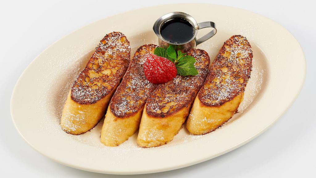 Bruléed French Toast · The “Best” French Toast Ever! Thick Slices of Rustic French Bread Grilled Golden Brown Topped with Powdered Sugar and Served with Maple-Butter Syrup