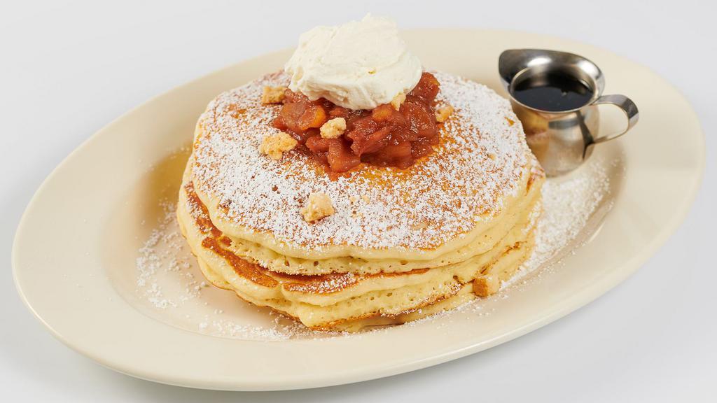 Caramel Apple Pancakes · Buttermilk Pancakes with Glazed Apples, Crispy Caramel Pecans and Chantilly Cream