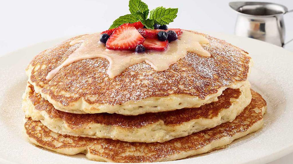 Lemon-Ricotta Pancakes · Our Buttermilk Pancakes with Ricotta Topped with Lemon Glaze, Strawberries and Blueberries