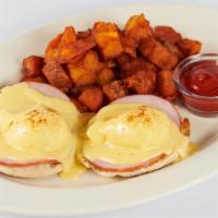 Eggs Benedict With Canadian Bacon And Hollandaise · 