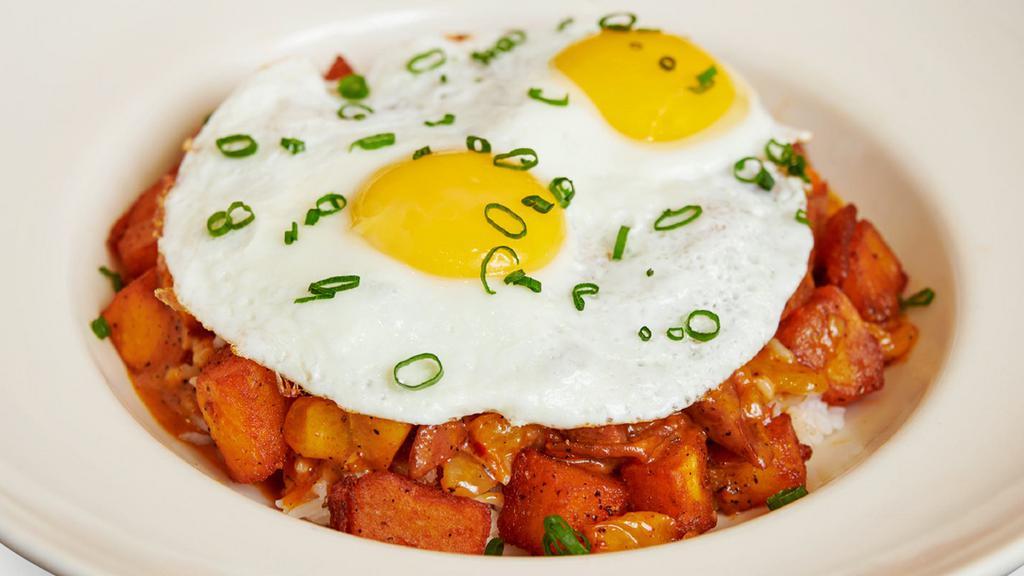 Jambalaya Hash & Eggs · Spicy Cajun Andouille Sausage Sautéed with Tomatoes, Peppers, Onion and Potatoes in a Spicy Sauce.  Served Over White Rice and Topped with Fried Eggs