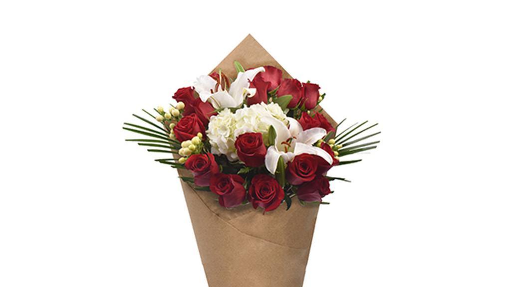 Bloom Haus 18 Plus Rose Bouquet - Red · A romantic gathering of deep red roses, paired with hydrangea and lilies, sends a heartfelt message of admiration and love. Wrapped in decorative packaging with accents of lush greens, this luxurious rose bouquet is a showstopper.