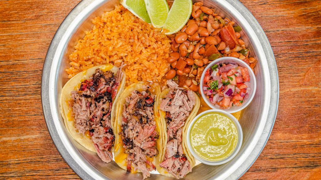 Brisket Taco Plate · 3 mini corn tortillas with Shredded Cheese and Brisket. Served with a side of Charro beans, Spanish Rice, Salsa Verde and Pico.