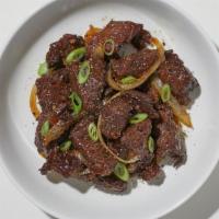 Black Pepper Beef · Tender sliced steak sautéed with white onions, bell pepper, and carrots in a garlic and blac...