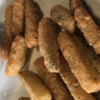 Fried Zucchini · Zucchini sticks dipped in an egg mixture with bread crumbs, parmesan cheese, baking powder a...