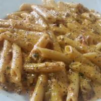 Ziti Bolognese · Tomato cream sauce with meat.