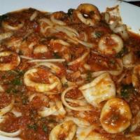 Calamari Over Linguini · Calamari over linguini with white or red sauce.