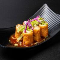 Viet Egg Rolls · BRAISED PORK, BOK CHOY, ONION + CARROTS WRAPPED IN A WONTON WRAPPER DEEP FRIED SERVEDWITH BI...