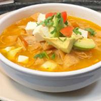 Tortilla Soup · Shredded all white meat, vegetables, crispy tortilla chips. Topped with avocado, crispy tort...