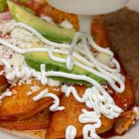 Enchiladas Mexicanas · Adobo dipped corn tortillas, your choice of meat, lettuce, tomato, crema, queso fresco, avoc...