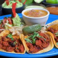 Plato Taquero · Five mini street tacos with your choice of meat, served with guacamole, pico, salad, grilled...