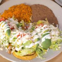 Sopes · Corn cakes topped with your choice of meat, lettuce, tomato, queso, crema, and avocado. Serv...