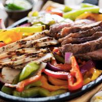 Beef & Chicken Parrillada · Mixed grill! 
Beef fajitas, chicken, and shrimp. Served with Spanish rice, charro beans, pic...