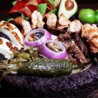 Molcajete De Mariscos · Sauteed shrimp, octopus, fish and scallops with our special sauce. Served with rice and beans.