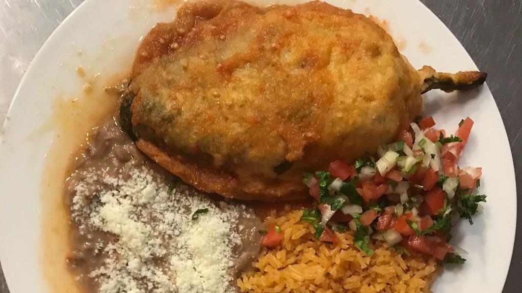 Chile Relleno (Stuffed Poblano Pepper) · Your choice of cheese or ground beef, rice, beans, lettuce, cheese, and sour cream.