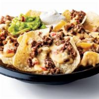 Ground Beef Nachos · Beef taco meat and crispy tortilla chips served with refried beans & queso with a side of so...