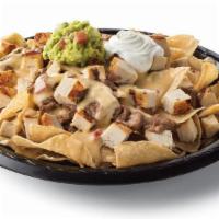Chicken Fajita Nachos · Diced chicken fajitas and crispy tortilla chips served with refried beans & queso with a sid...