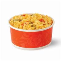 Mexican Rice · Savory Mexican rice simmered with poblano peppers, tomatoes and spices. Available during lun...