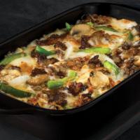 The Philly Bowl · Crustless pizza baked in a bowl. Melty white cheese sauce, tender shaved steak, marinated mu...