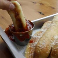 6 Bread Sticks · Buttery garlic bread topped with grated parmesan and served with warm marinara.