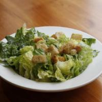 Caesar Salad · Crispy romaine lettuce tosssed in house made Caesar dressing, shredded parmesan, and crispy ...