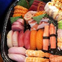 Shogun Love Boat · For 3 people. 15 pieces premium sashimi, 12 pieces sushi, Rainbow roll& Shaggy dog roll