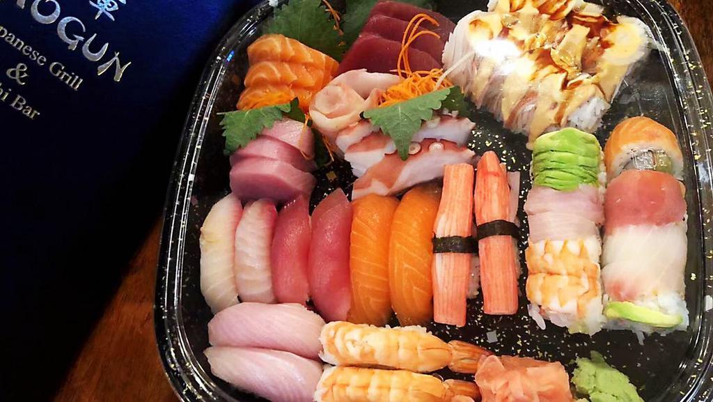 Shogun Love Boat · For 3 people. 15 pieces premium sashimi, 12 pieces sushi, Rainbow roll& Shaggy dog roll